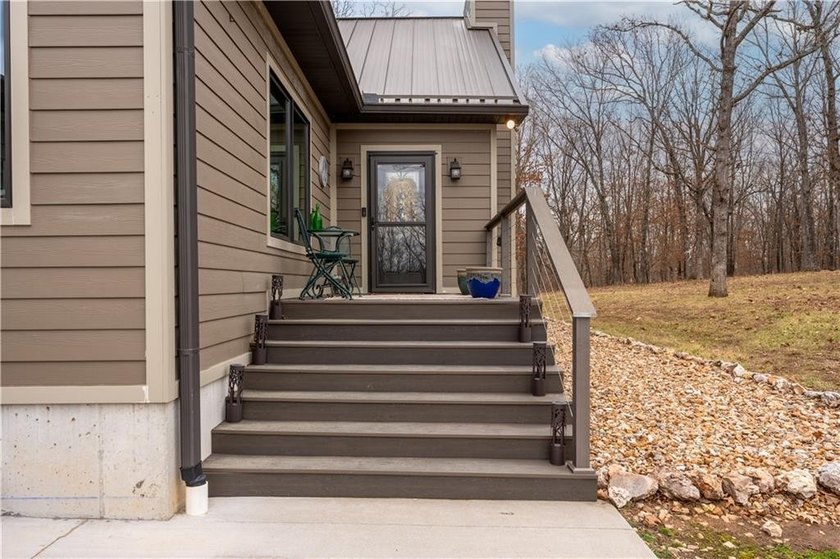 Indulge in waterfront living on approximately 5 serene acres at - photo 16