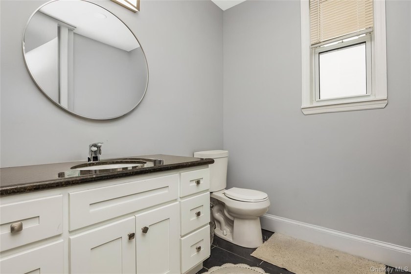 Sophisticated Living Across Two Floors &amp; Finished Basement Step - photo 15