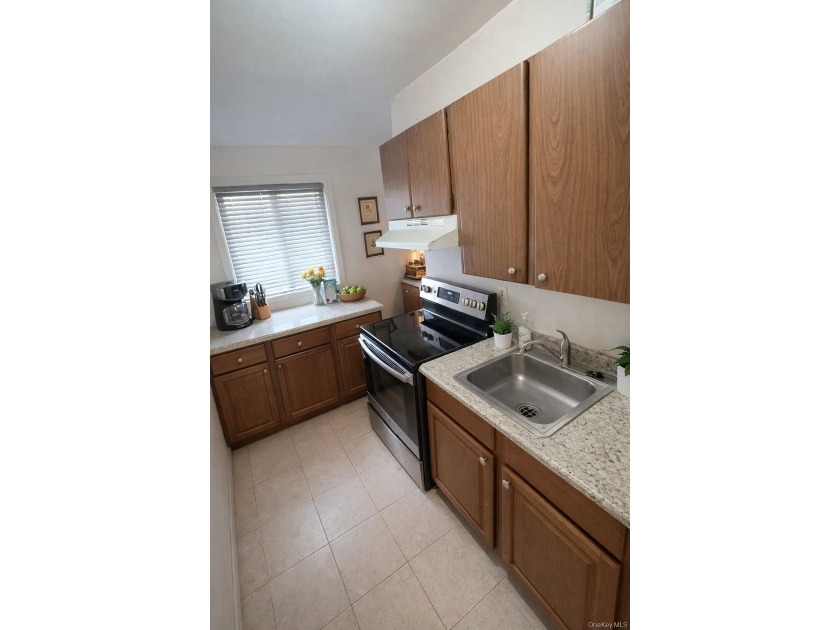 Discover your new beginning in the heart of Islip! This spacious - photo 11