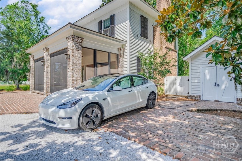 Tucked gracefully into its surroundings, and overlooking the - photo 8