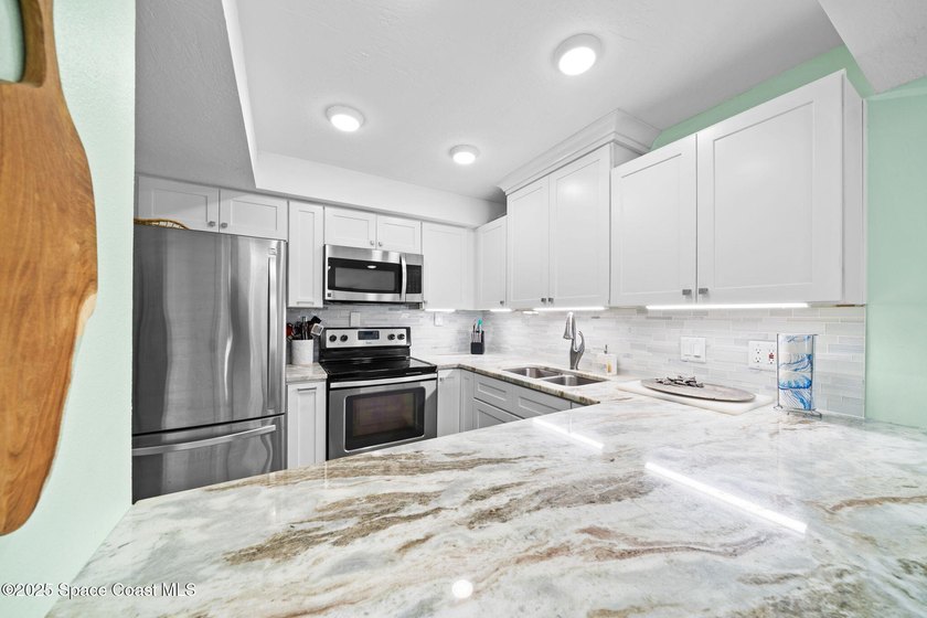 Live the coastal dream in this beautifully updated ground floor - photo 10