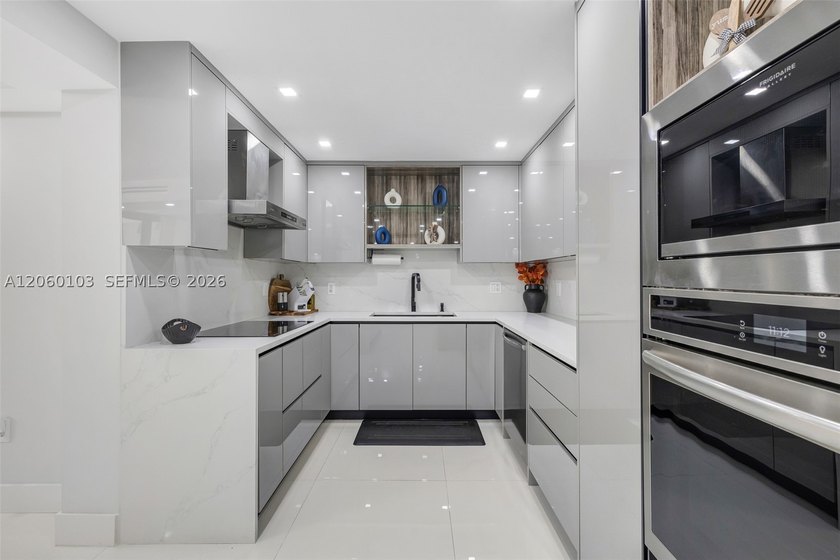 Step off the elevator on the second floor and into a home that - photo 3