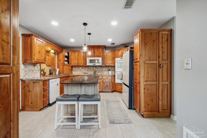 Discover a rare, one-owner lakefront retreat designed as an - photo 31