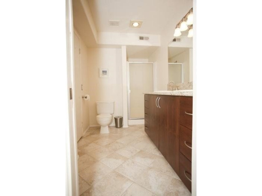 Welcome to this updated two-bedroom, two-bath condominium - photo 7