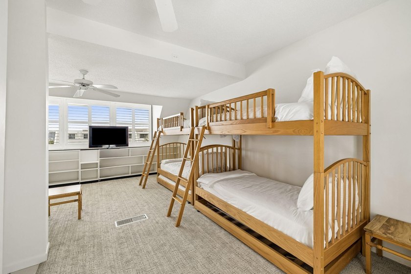Experience exceptional beachfront living from this beautifully - photo 29