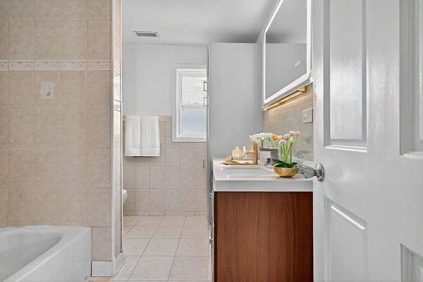 Welcome to this beautiful 3-bedroom, 2-bath home. Inside, you'll - photo 8