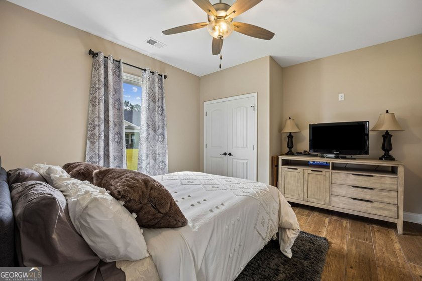 SHOWING LIKE A MODEL HOME, this exceptional custom-built - photo 32