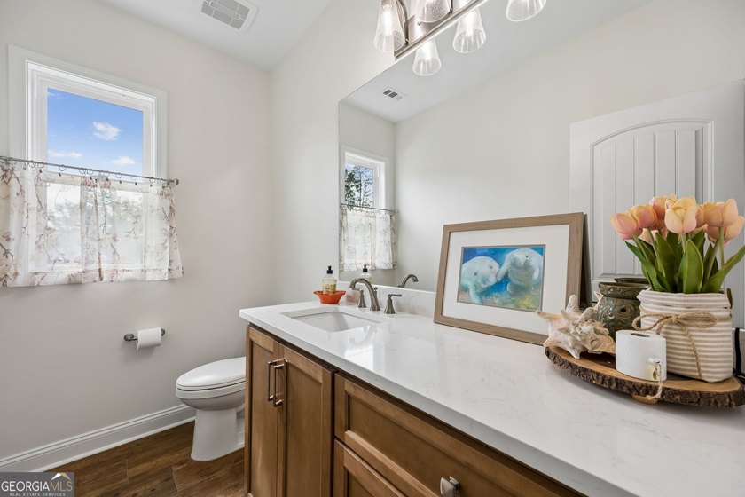 SHOWING LIKE A MODEL HOME, this exceptional custom-built - photo 37