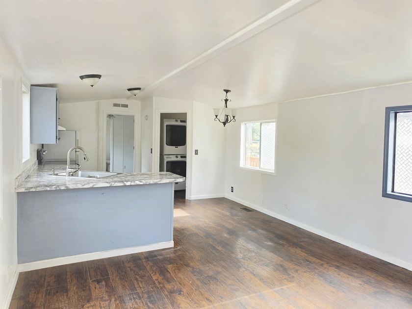 This is a charming, move-in-ready mobile home located in a - photo 3