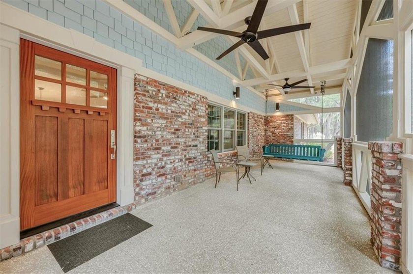 Set beneath a quiet canopy of live oaks, 636 Old Plantation Road - photo 6
