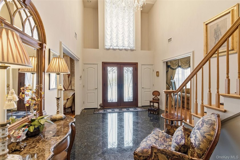 FLOWER HILL, ROSLYN | BRICK CENTER HALL COLONIAL. Located on a - photo 3