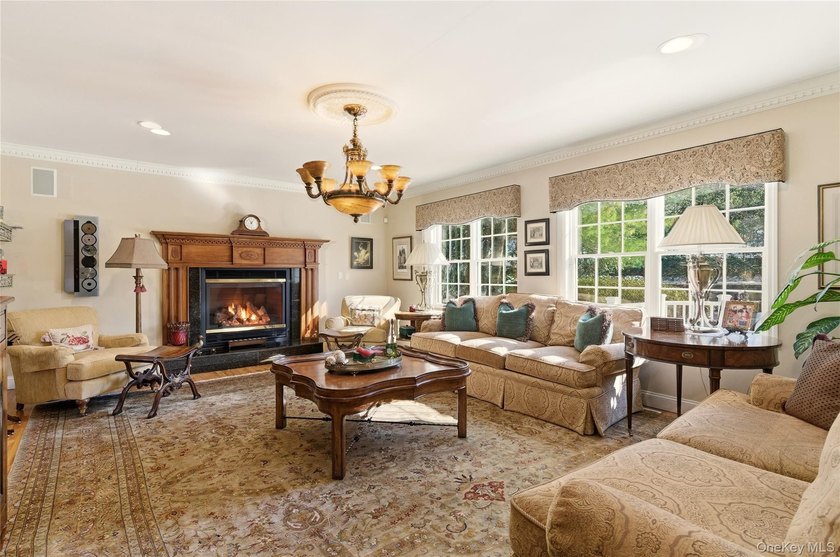 FLOWER HILL, ROSLYN | BRICK CENTER HALL COLONIAL. Located on a - photo 9
