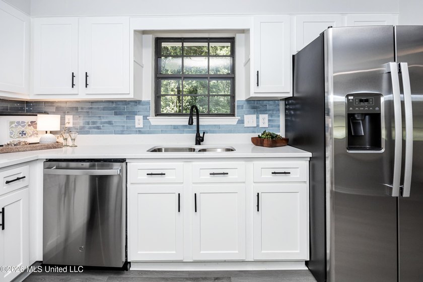Stunning newly renovated white brick home in DOWNTOWN GOLF CART - photo 15
