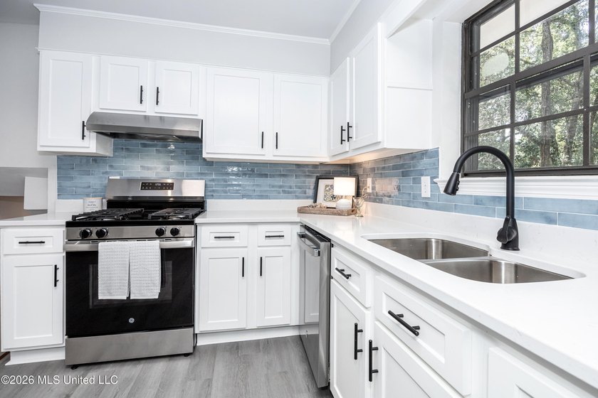 Stunning newly renovated white brick home in DOWNTOWN GOLF CART - photo 17