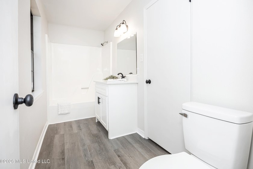 Stunning newly renovated white brick home in DOWNTOWN GOLF CART - photo 46