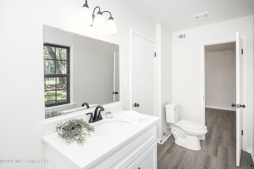 Stunning newly renovated white brick home in DOWNTOWN GOLF CART - photo 47