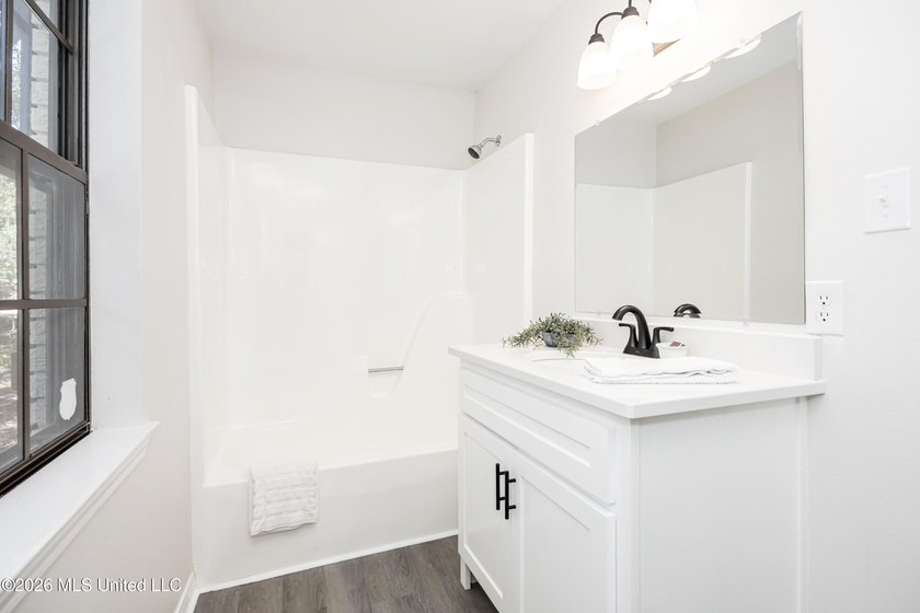 Stunning newly renovated white brick home in DOWNTOWN GOLF CART - photo 48