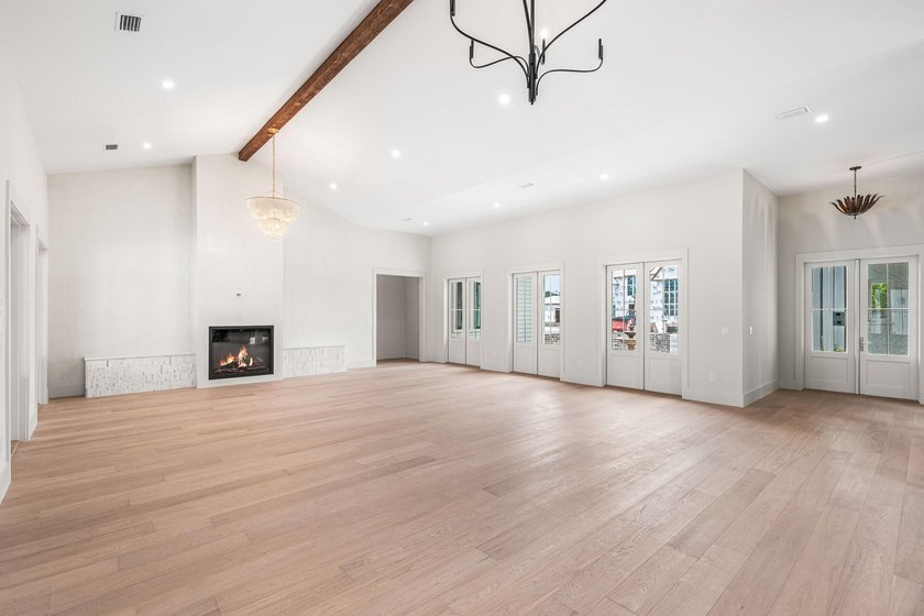 A showstopper of modern coastal elegance, 36 Sandcord Drive is a - photo 12