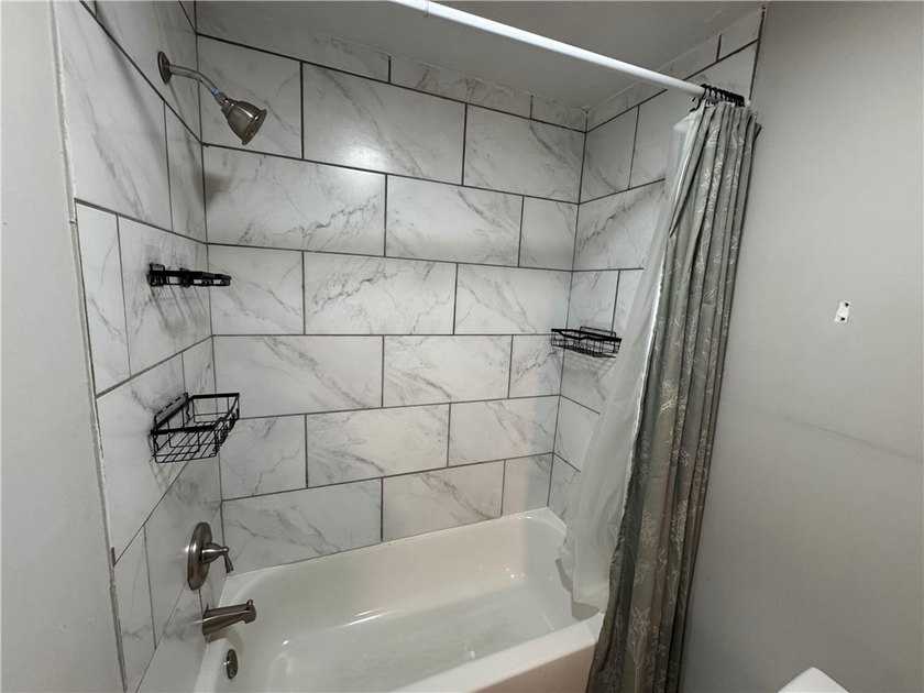 Check out this side-by-side duplex in North Winton Village! With - photo 18