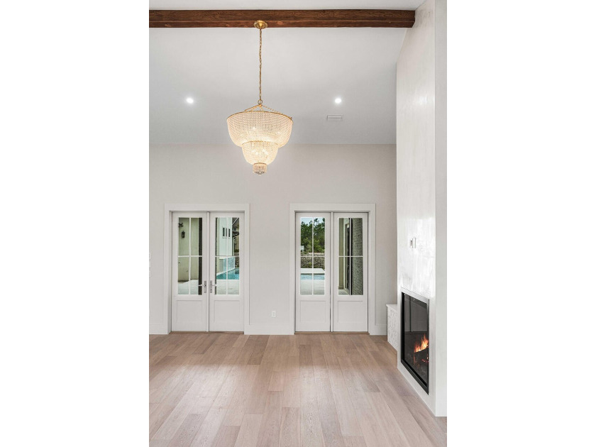 A showstopper of modern coastal elegance, 36 Sandcord Drive is a - photo 18