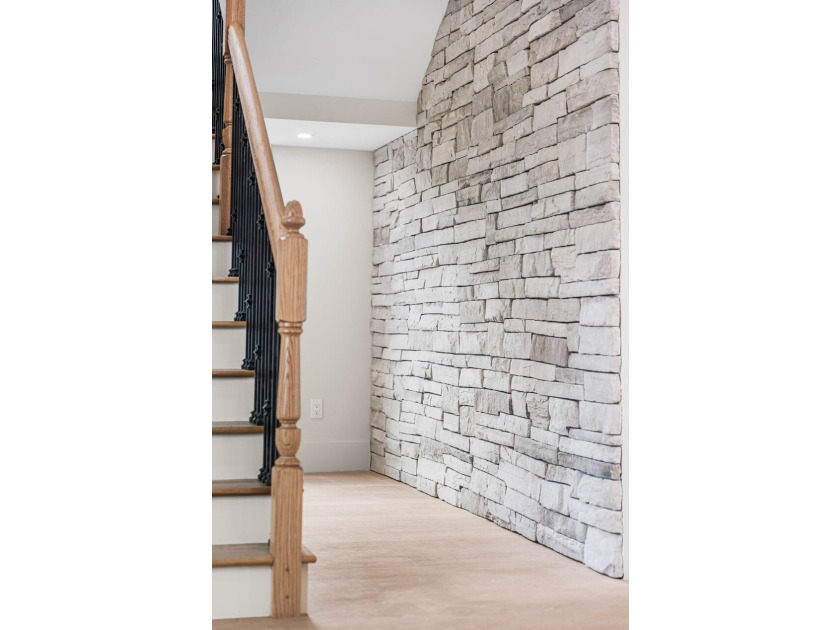 A showstopper of modern coastal elegance, 36 Sandcord Drive is a - photo 26