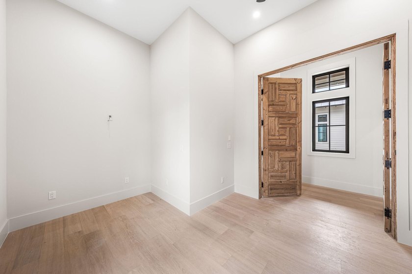 A showstopper of modern coastal elegance, 36 Sandcord Drive is a - photo 32