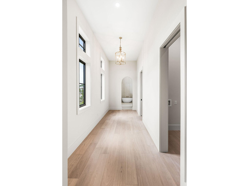 A showstopper of modern coastal elegance, 36 Sandcord Drive is a - photo 34