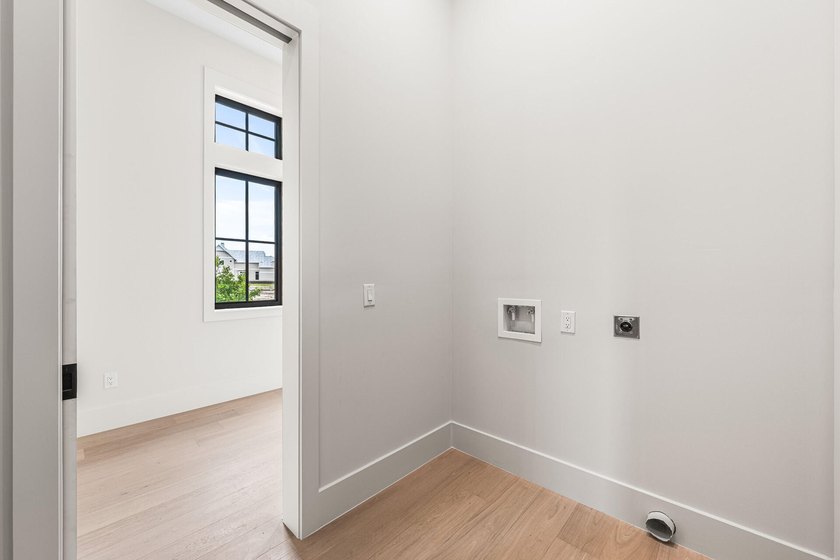 A showstopper of modern coastal elegance, 36 Sandcord Drive is a - photo 37