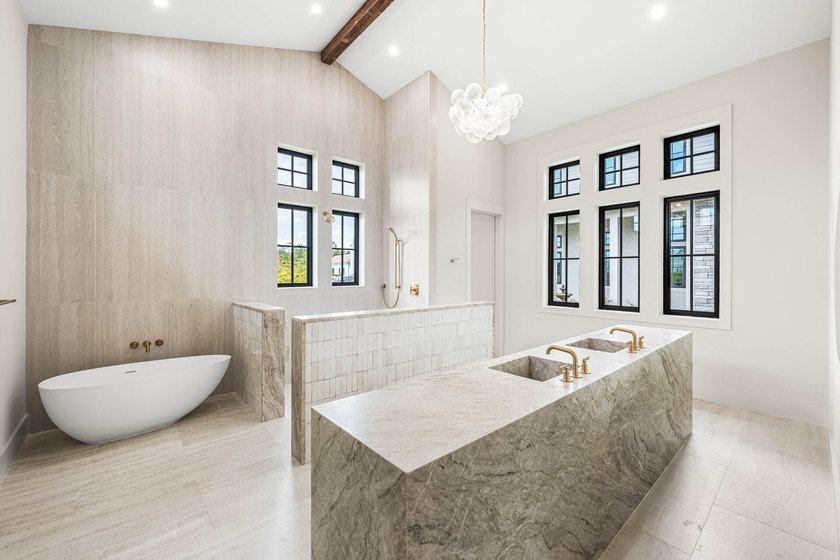 A showstopper of modern coastal elegance, 36 Sandcord Drive is a - photo 41