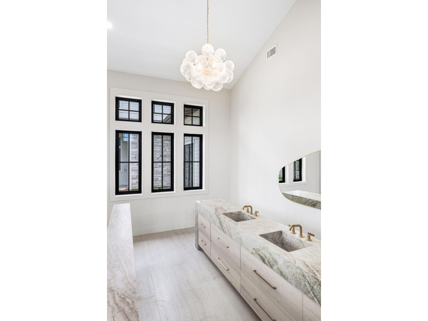 A showstopper of modern coastal elegance, 36 Sandcord Drive is a - photo 46