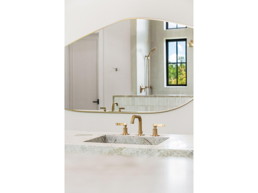 A showstopper of modern coastal elegance, 36 Sandcord Drive is a - photo 47