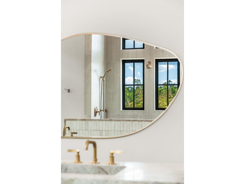 A showstopper of modern coastal elegance, 36 Sandcord Drive is a - photo 48