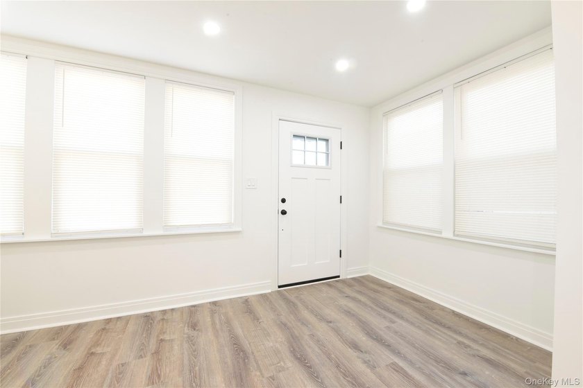 This colonial home has been extensively renovated and features a - photo 5