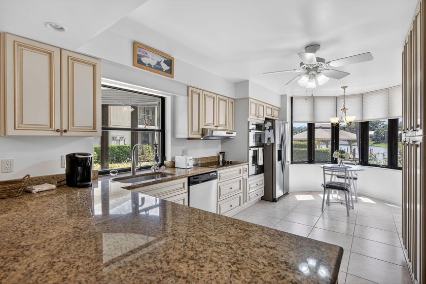 Desirable 1st floor corner unit with a beautiful lake view - photo 11