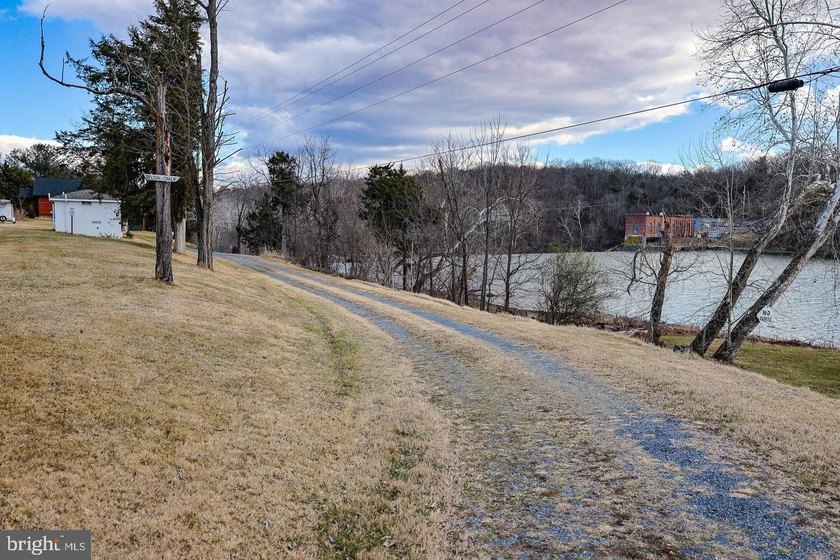 Discover the possibilities on Riverbend Drive. Tucked within a - photo 22