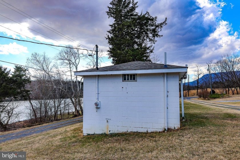 Discover the possibilities on Riverbend Drive. Tucked within a - photo 24
