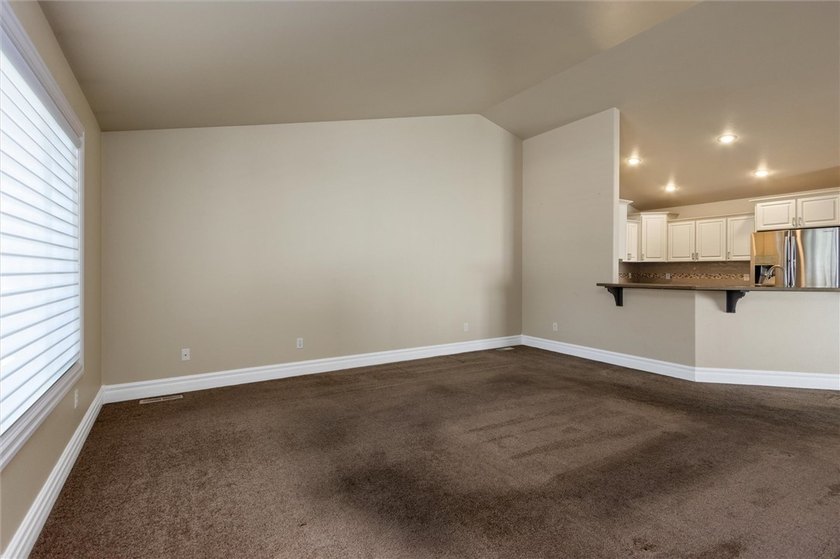 2,370 square foot 4 bedroom, 3 bath ranch style townhome. 2 car - photo 2