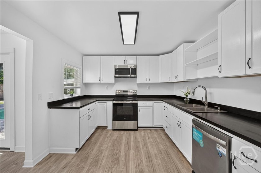 Where else can you own a beautifully updated 4-bedroom, 2 bath - photo 10