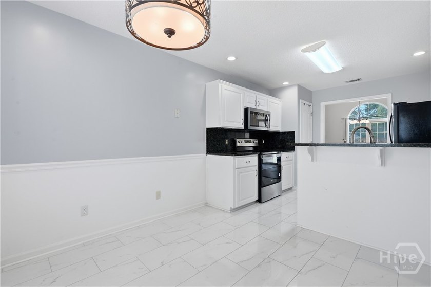 This beautifully maintained 3-bedroom, 2 bath Ranch Home is - photo 8