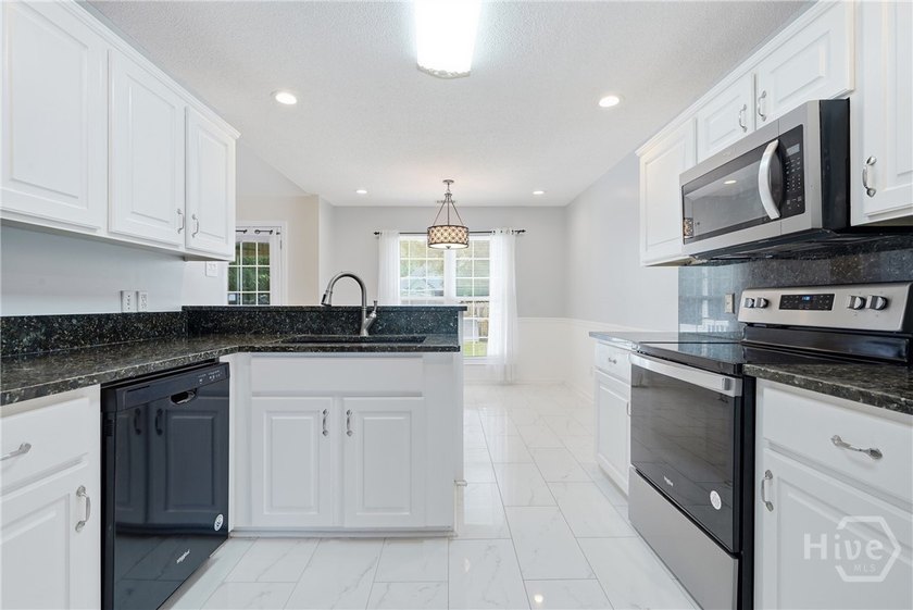 This beautifully maintained 3-bedroom, 2 bath Ranch Home is - photo 9