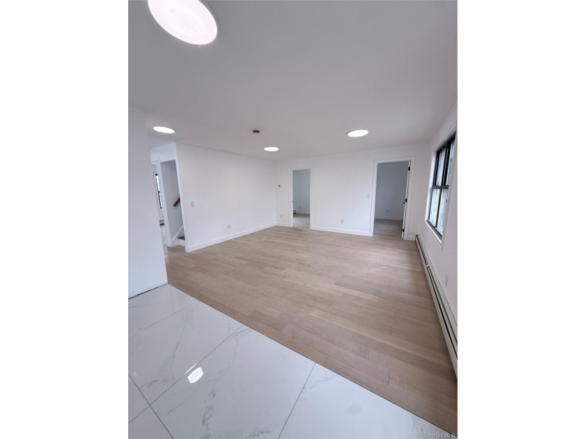 Welcome to this beautifully renovated one-family home with an - photo 11