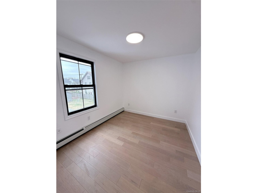 Welcome to this beautifully renovated one-family home with an - photo 12