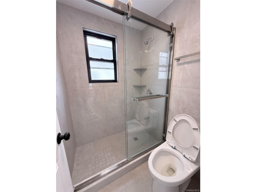 Welcome to this beautifully renovated one-family home with an - photo 14