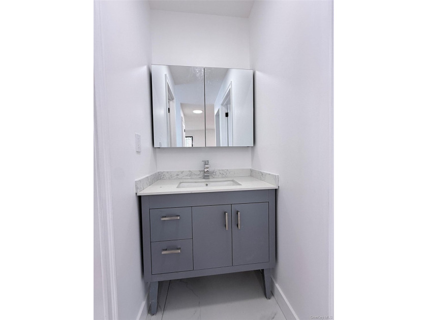 Welcome to this beautifully renovated one-family home with an - photo 15