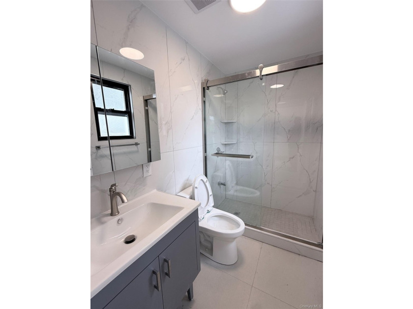 Welcome to this beautifully renovated one-family home with an - photo 17