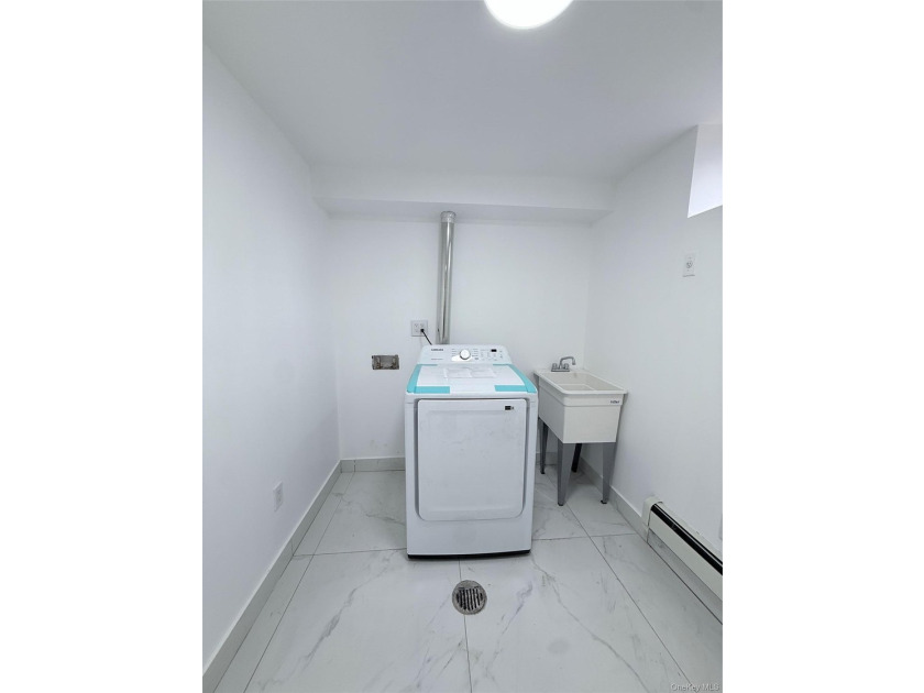 Welcome to this beautifully renovated one-family home with an - photo 21