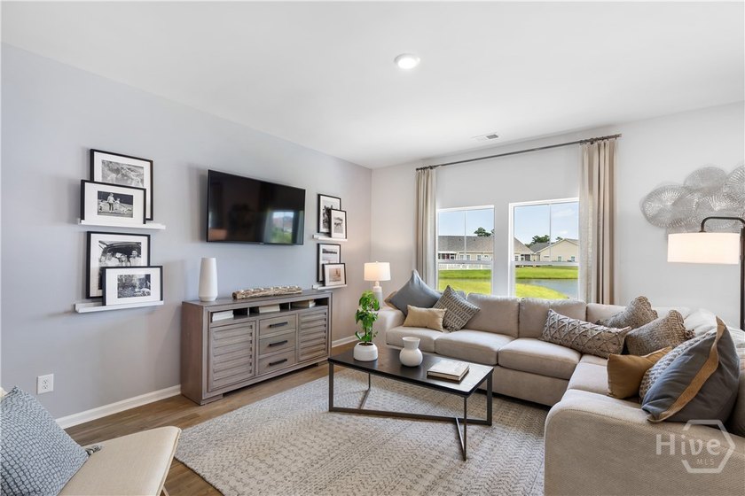 This single-story Dover home design features two bedrooms and a - photo 4