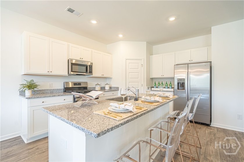 This single-story Hartford home design features an open space - photo 5