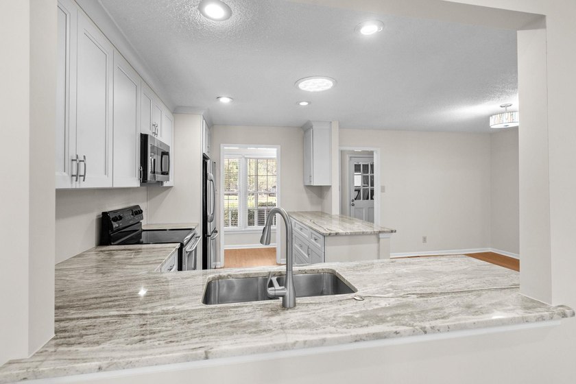 Nestled on a large, shaded 0.48-acre corner lot in the heart of - photo 11
