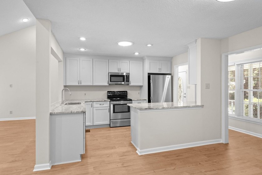 Nestled on a large, shaded 0.48-acre corner lot in the heart of - photo 13
